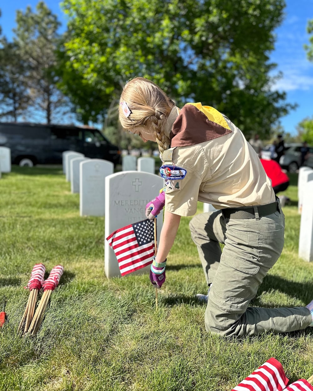 Troop 114G community service placing flags at Fort Morgan National Cemetary